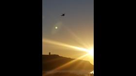 Search and Rescue helicopter 924 in the sky over Summerleaze Bay, Bude