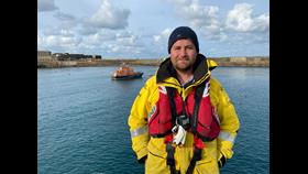 Newly fledged Coxswain - Saul Woodruff with Inner Wheel II in the background