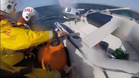 Newquay RNLI crew retrieving casualty vessel