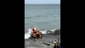 Lifeboat being recovered to trailer.