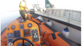 Gravesend's orange Lifeboat is next to the white casualty vessel setting up secure lines