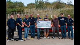 Giant Cheque for £1,000 from Colwyn PWC Riders being presented to Pwllheli RNLI