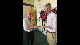 Peter Sparkes presenting Excellence in Volunteering Award to Laurie Pavelin