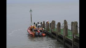 Aberystwyth RNLI Lifeboat crew displaying capabilities of the Atlantic 85 at the official reopening of Aberystwyth's famous jetty.