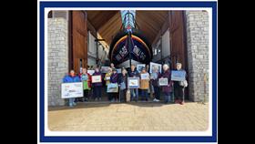 Exmouth RNLI are presented with 24 paintings by Exmouth Art Group to commemorate 200 years of saving lives at sea