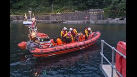 Looe RNLI Atlantic 85 Sheila and Dennis Tongue II at the landing pontoon after dropping off the casualties