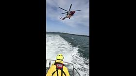 Rescue 175 and Yarmouth RNLI returning to base