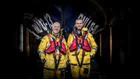Father and son Steve and Felix Williams standing in front of Swanage lifeboat