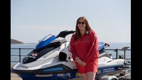 Scarborough Lifeguard with Rescue Water Craft after a very busy weekend. Lifeguard female with Rescue water craft full RNLI branding