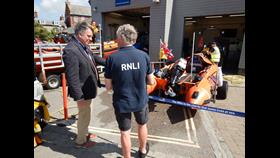 Dr Tim Fooks, High Sheriff of West Sussex (left) and Nick White, Lifeboat Operations Manager at Littlehampton lifeboat station (right) discuss the station's newest lifeboat D-902 Spirit of Fidelity.