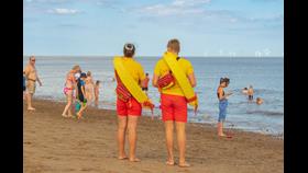 RNLI Lifeguards patrolling during busy summer season in Skegness