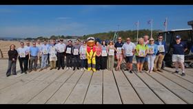 Sponsors and supporters of the Exmouth RNLI Welly Trail with certificates and Stormy Stan