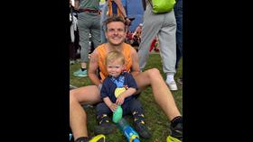 Jonny with his young son wearing his London Marathon medal after the race