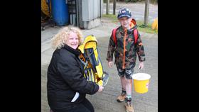 The Station LOM gives Johnathon his kit bag.