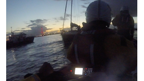 Casualty yacht seen from Gravesend Lifeboat with Harbour Launch Kew nearby