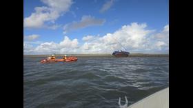 Barrow Inshore Lifeboat with the grounded yacht