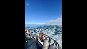 All-weather lifeboat towing casualties back to safety of Ballylumford Harbour
