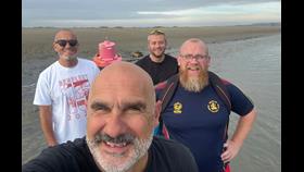 Four of the 1crew training on Leigh-on-Sea mud flats at low tide