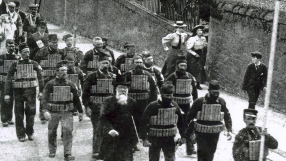 North Berwick 1901. Lifeboat crew members in cork lifejackets lead a parade during the coronation celebrations for Edward VII