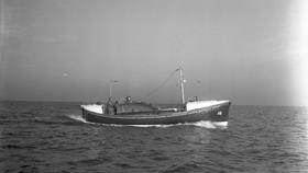 Black and white image of Scarborough lifeboat, E.C.J.R., while on trials