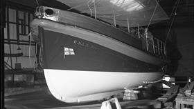 Black and white image of Shoreham lifeboat, Dorothy and Philip Constant, inside boatbuilders