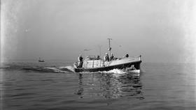 Black and white image of Llandudno lifeboat, Lilly Wainright, while on trials