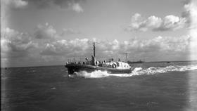 Black and white image of Tenby lifeboat, Henry Coomber Brown, while on trials