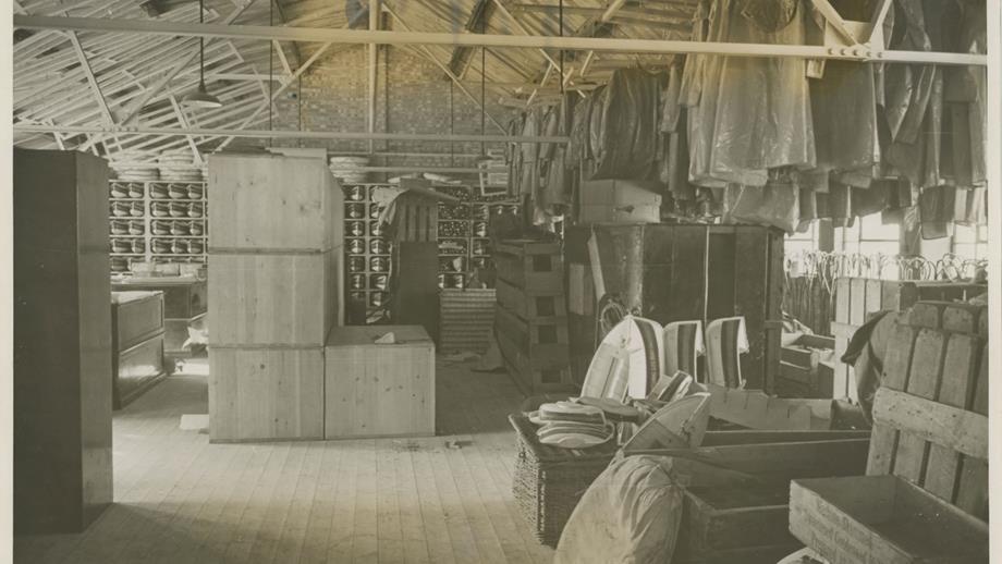 Black and white image of depot stores filled with crew kit, crates and collection boxes