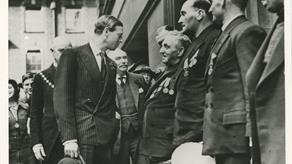 Black and white image of crew meeting HRH Prince George, Duke of Kent