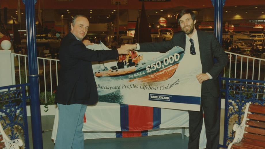 Colour image of giant cheque being presented