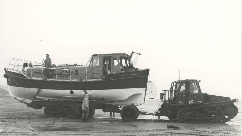 Black and white image of tractor towing Hoylake lifeboat