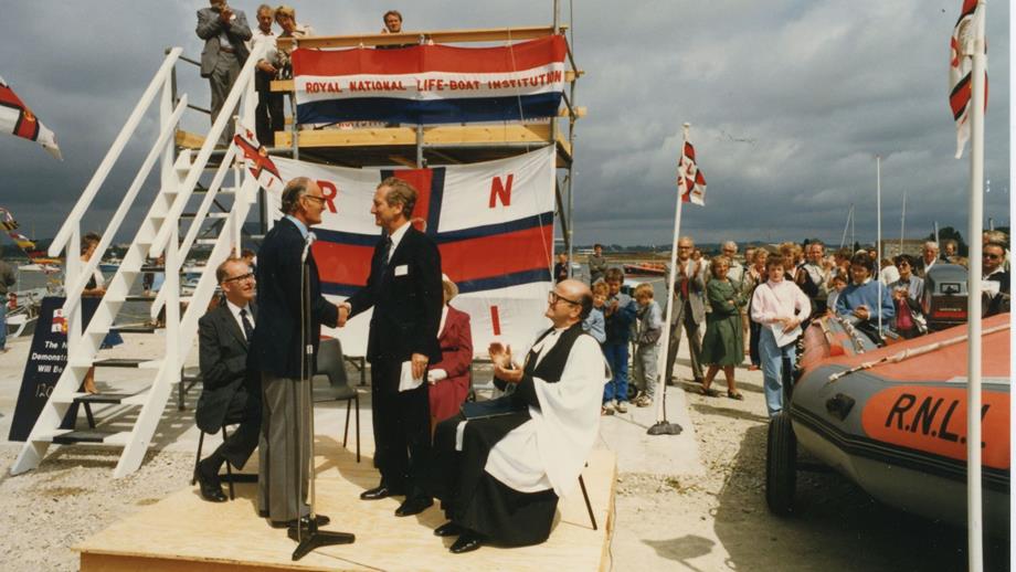 Colour image of handing over of inshore lifeboat