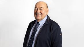 Headshot of a man wearing a suit