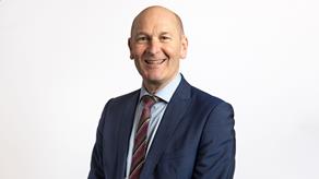 Headshot of a man wearing a suit