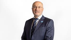 Headshot of a man wearing a suit