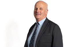 Headshot of a man wearing a suit