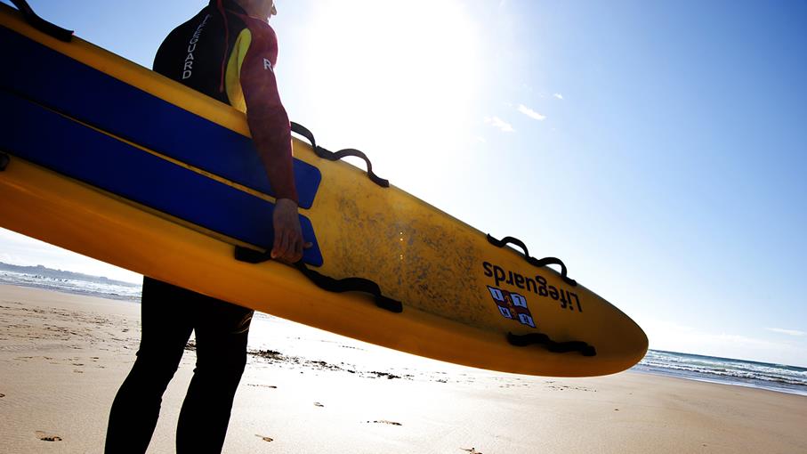 RNLI Lifeguard with rescue board