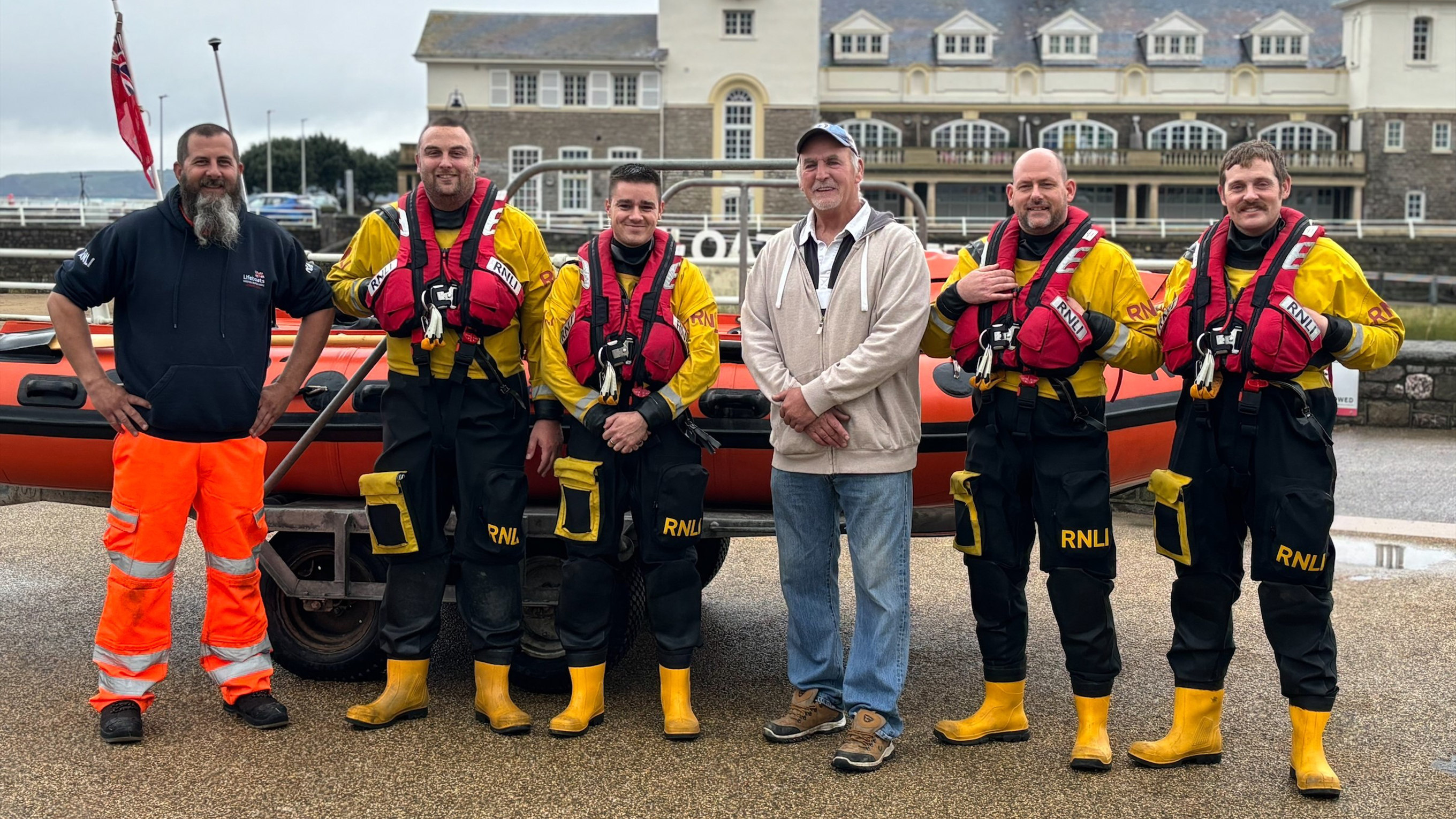 Allan Grant (centre) and some of the lifeboat volunteers who saved his life, including (left) Andy Stoner