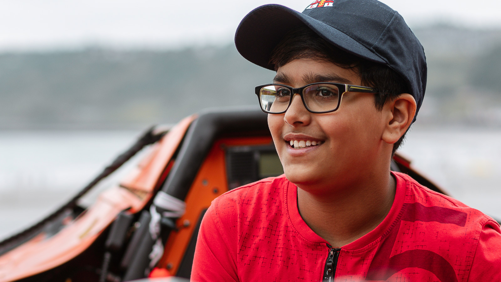 Photo of Ravi, smiling on a boat