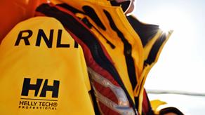 Close up of the RNLI’s all-weather lifeboat crew kit featuring the RNLI and Helly Hansen branding on the shoulder