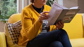 Lady reading gift in wills pack