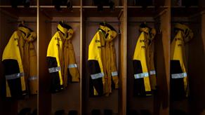 Yellow Helly Hansen all-weather lifeboat jackets hanging up at Selsey Lifeboat Station