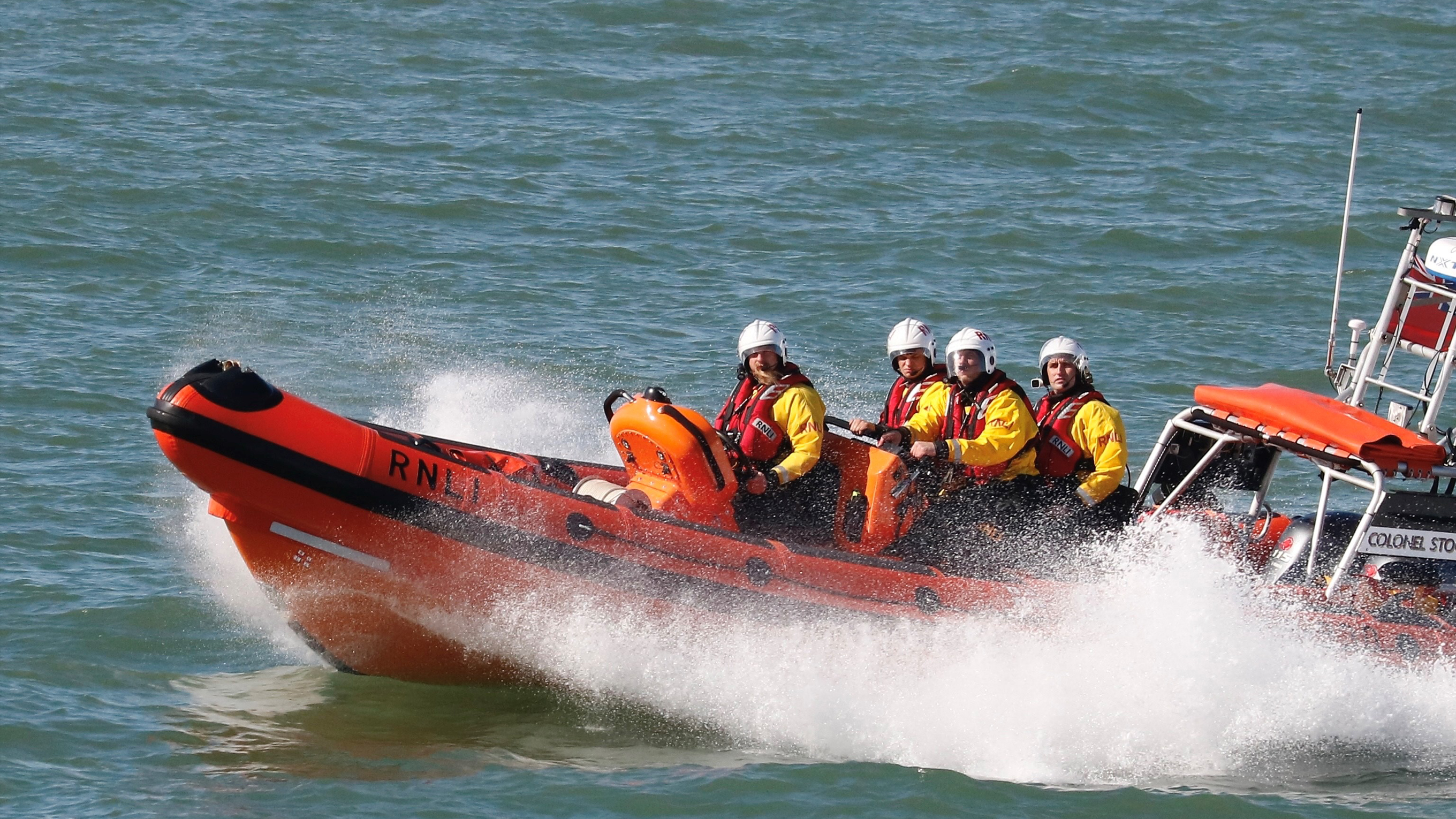 Crew members onboard a lifeboat at sea