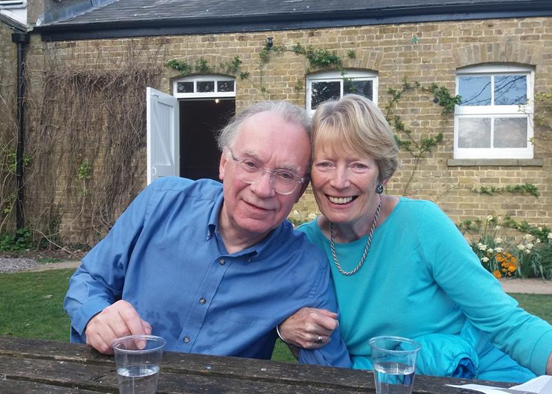 Two people smiling at the camera