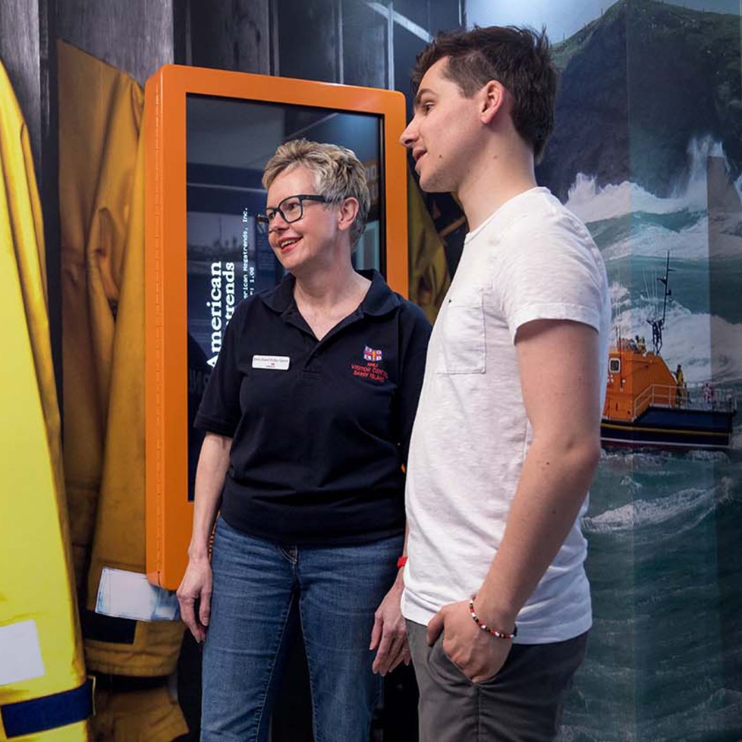 Volunteers stood by promotional RNLI assets