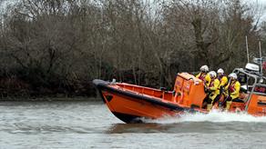 Chiswick’s E class lifeboat Brawn Challenge during a training exercise on the River Thames. There are three crew members onboard.