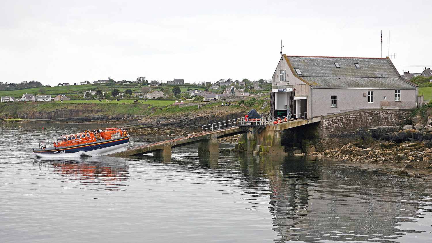 Moelfre RNLI’s former all-weather Tyne class lifeboat, Robert and Violet 47-013, launching from the former lifeboat station