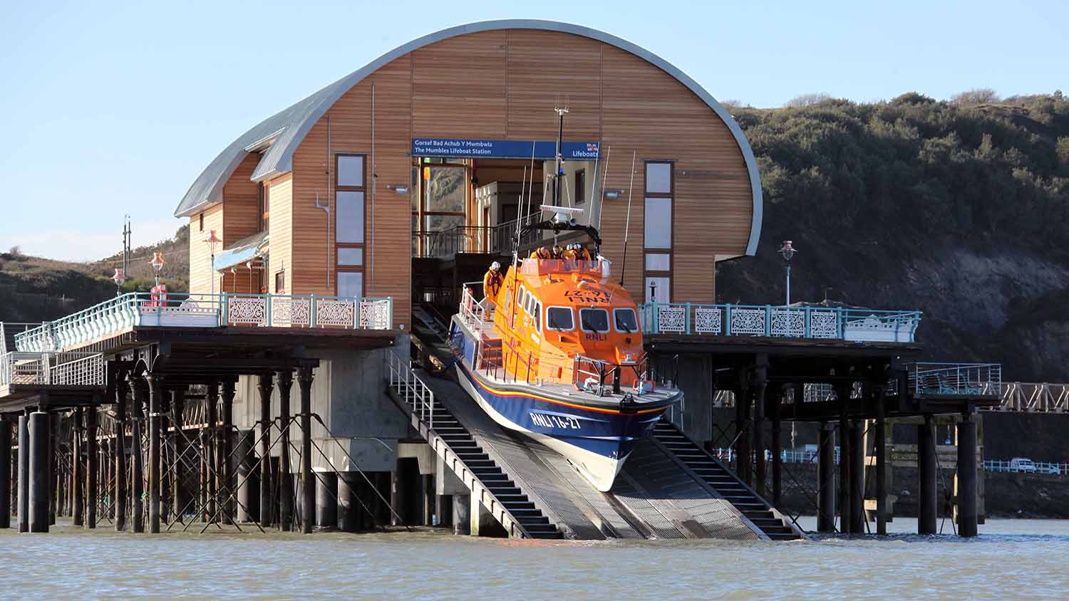 The Mumbles RNLI’s Tamar class lifeboat, Roy Barker IV 16-27, launching down the slipway of the new boathouse