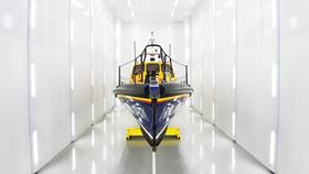 Relief Shannon class lifeboat, Reg 13-07, inside a spray booth at our All-weather Lifeboat Centre