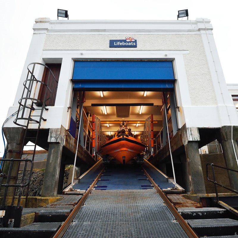 View from the bottom of the lift looking up at Port Erin Lifeboat Station with a B class inshore lifeboat in its carriage.